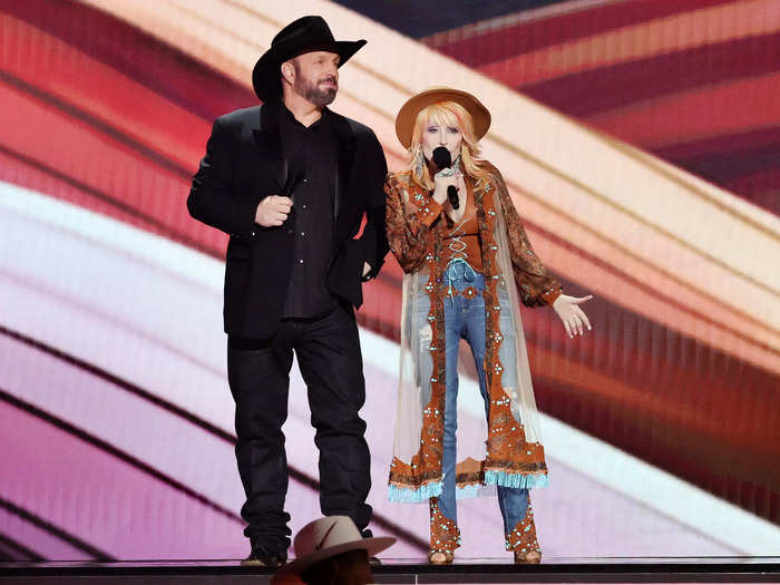 Parton also wore an embellished robe, brown top, and blue jeans at the ACM Awards.