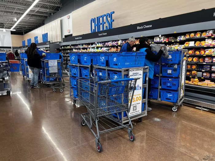 There were also workers filling blue bins on carts for online orders.