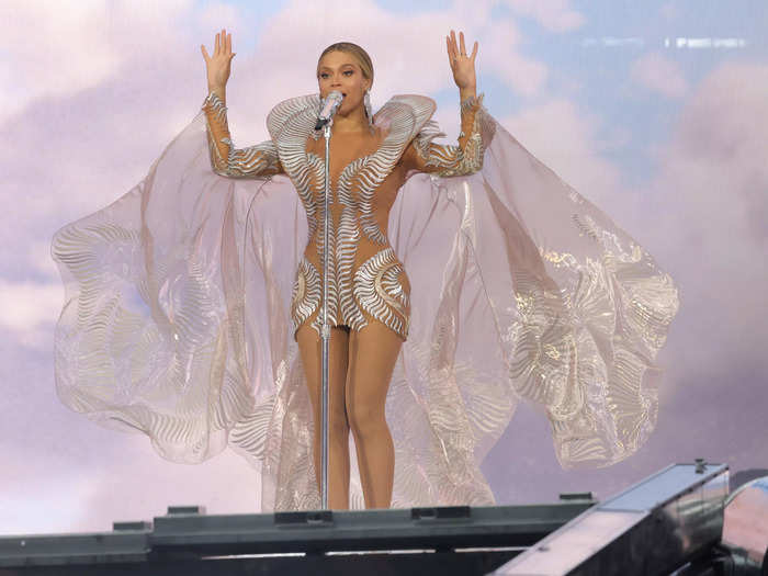 The sheer minidress Beyoncé wore during a June stop in Amsterdam featured a billowing cape. 