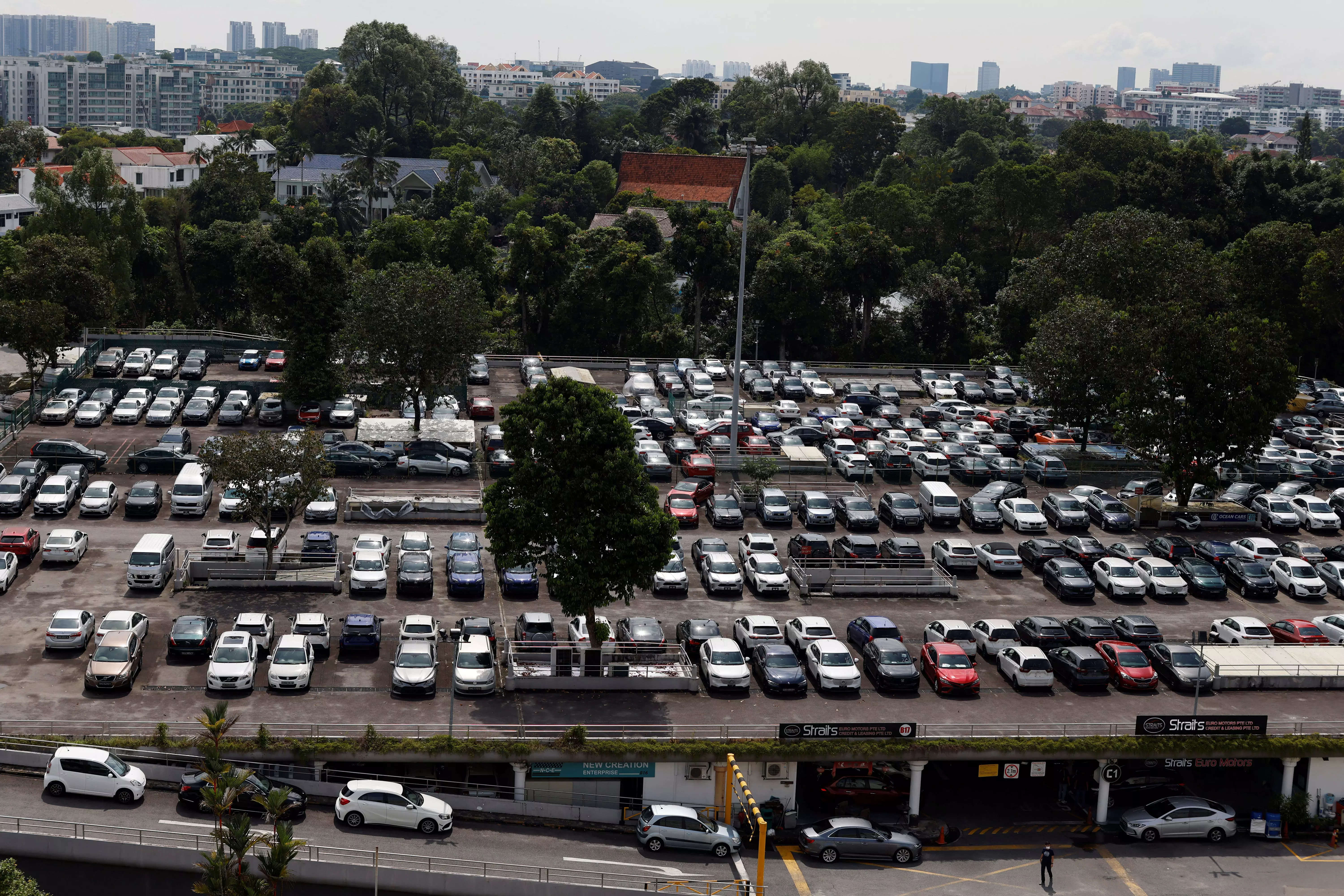 Cars for sale are parked at used car dealerships in Singapore October 17, 2022.