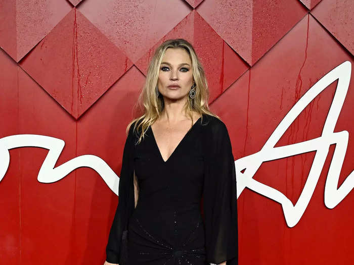 Kate Moss wore a black, cape-style gown that was almost too understated. 