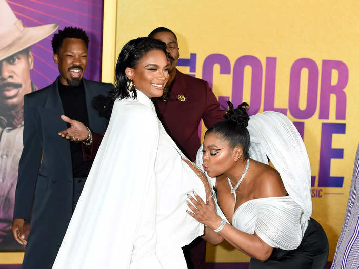 In a sweet moment, her costar Taraji P. Henson leaned down to kiss her bump in front of the cameras.