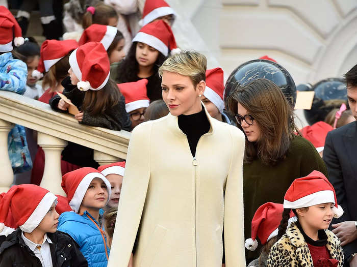 While distributing Christmas gifts to children in Monaco in 2015, Charlene stood out in a beige cape jacket.