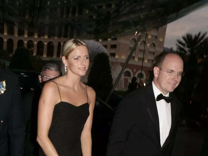 Charlene and Albert made their first public appearance as a couple at a 2006 F1 Monaco Grand Prix party. For the big night, she wore a black floor-length gown. 