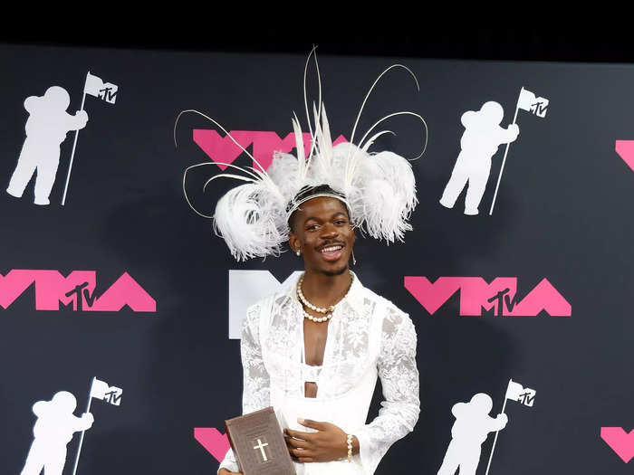 Lil Nas X attended the MTV VMAs in a white corset dress.