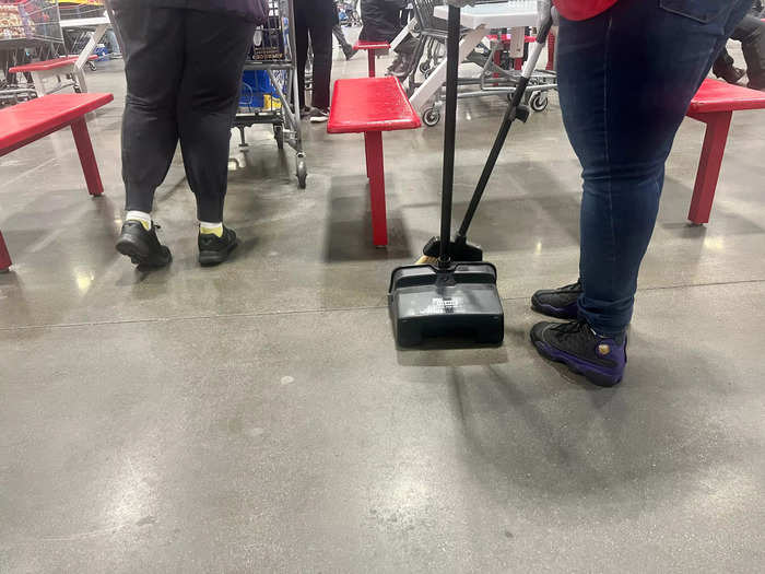 Costco employees rush to clean any dirt on the floor, even if that