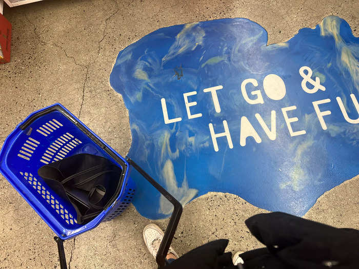 At the bottom of the escalator, I found a selection of wheeled baskets and a mural telling me to "let go and have fun." So, I did.