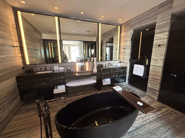 The bathroom was enormous, with a full soaking tub in the middle of the room.