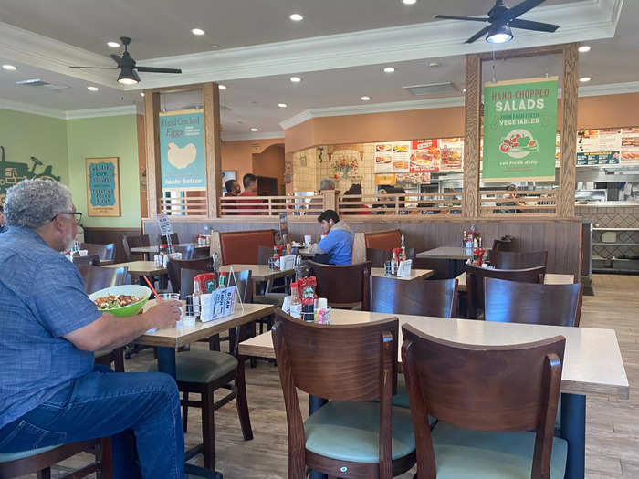 A casual seating area was surrounded by booths lining the walls.