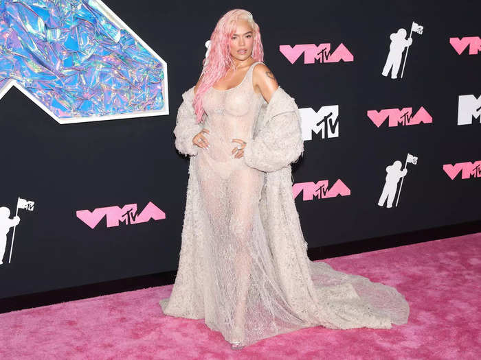 Karol G kept things pastel on the VMAs red carpet in September.