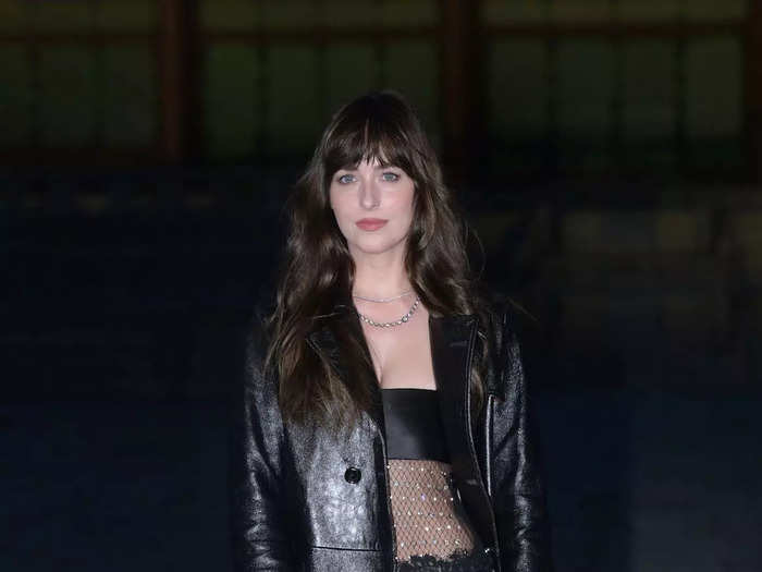 Dakota Johnson embraced the visible lingerie trend that month at a Gucci fashion show.