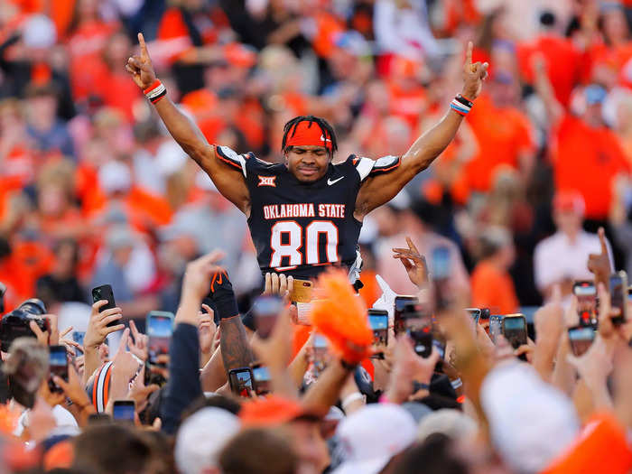 Oklahoma State wide receiver Brennan Presley celebrates the Cowboys