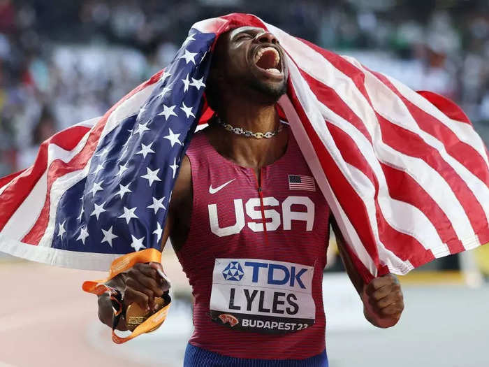 Noah Lyles celebrates his gold medal win in the men