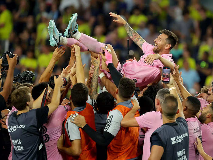 Lionel Messi of Inter Miami is hoisted in the air by his teammates after winning the Leagues Cup 2023 final match against Nashville SC on August 19. 