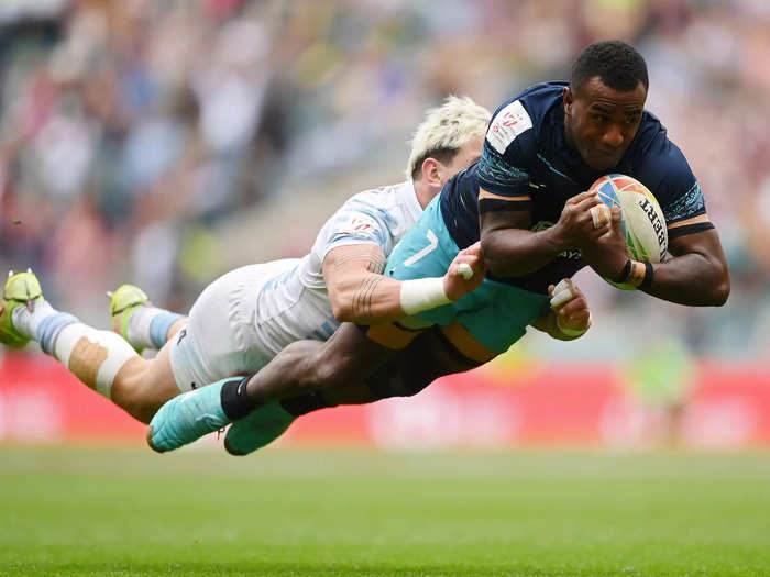 Filipe Sauturaga of Fiji scores a try under pressure from Argentina