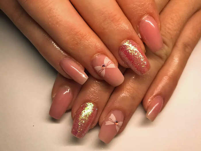 Balletcore nails combine pink hues and fun details.