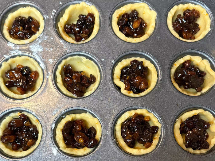 Add about a teaspoon of mincemeat to each pastry cup in your tin.