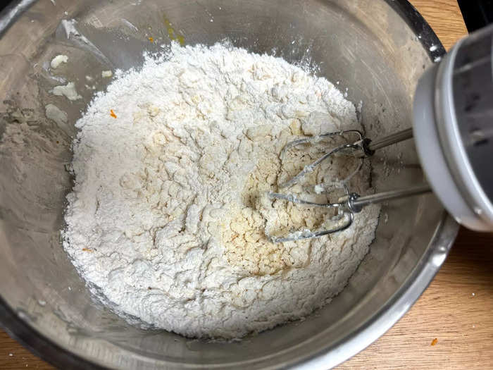 Next, add your egg, flour, ground almonds or almond flour, and orange zest to the bowl with your butter and sugar mixture. 