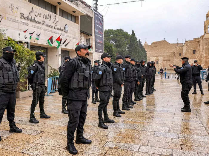 Palestinian police officers lined up in Manger Square on Christmas Eve.