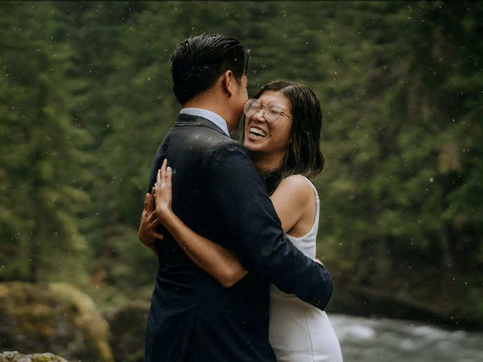 Not even a little drizzle could wipe the smile of this bride