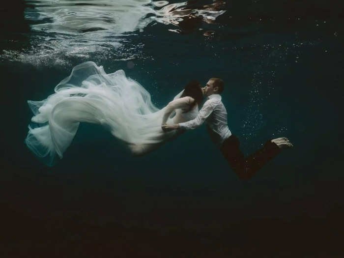 An underwater shot captures this bride