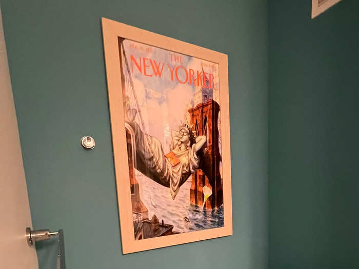 In the bathroom, there was a framed cover of an issue of The New Yorker with the Statue of Liberty relaxing, using the Brooklyn Bridge as a hammock.