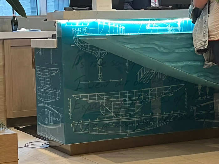 The desk itself was covered in boat schematics and the lyrics to Buffett