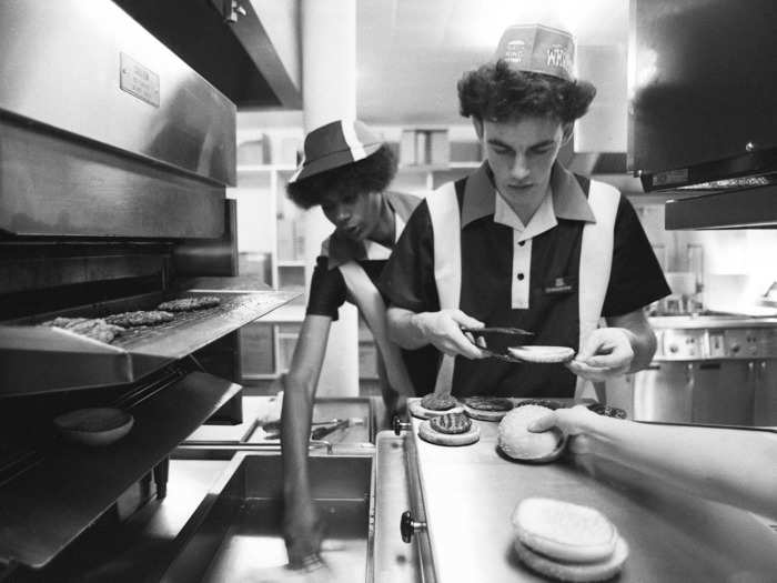 The Burger King employee uniform featured hats and striped polo shirts.