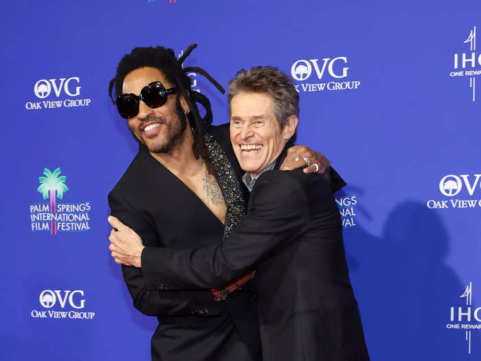 Lenny Kravitz and Willem Dafoe also posed together and were seen hugging in their all-black ensembles.