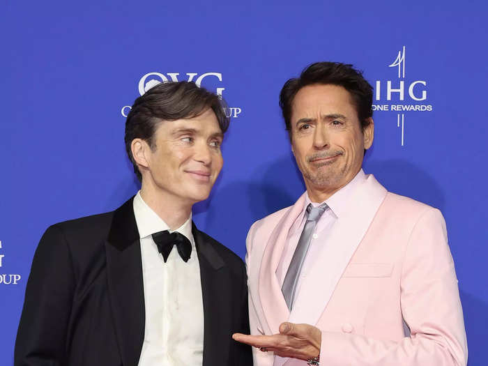 "Oppenheimer" stars Cillian Murphy and Robert Downey Jr. posed together on the carpet in their two very different tailored looks.