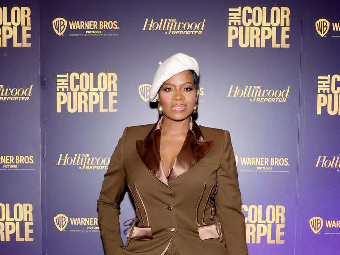 Barrino topped her all-brown ensemble with a white beret that same month. 