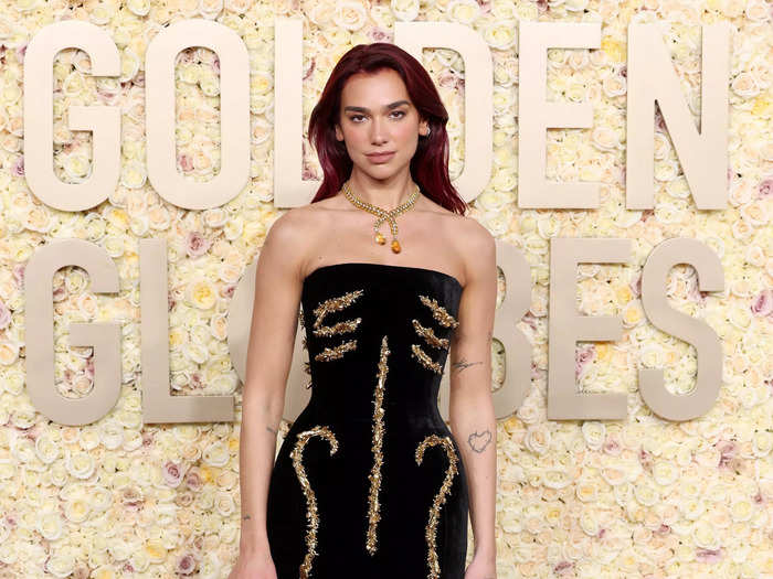 Dua Lipa arrived at the awards show in a custom Schiaparelli dress.