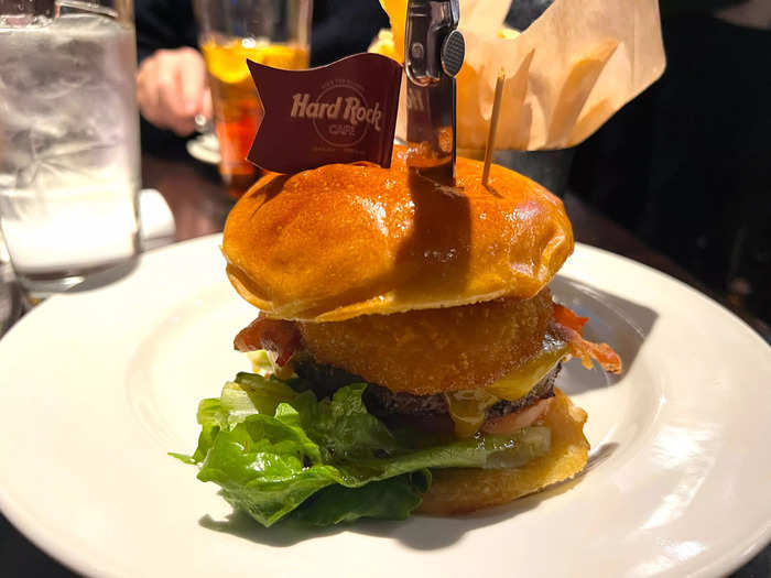 In terms of quality, this burger was way better. It was juicier, came with onion rings, and even had a cute little flag on top.