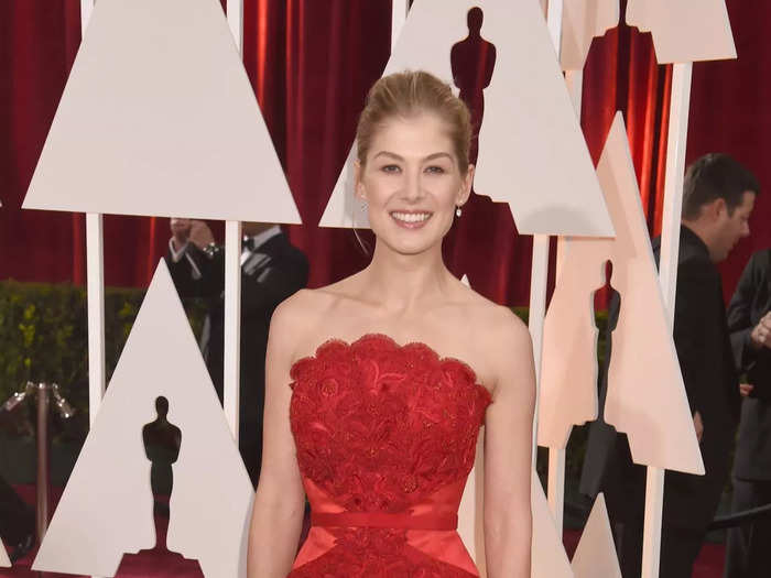 After the success of "Gone Girl," Pike attended the 2015 Oscars in a sleeveless scarlet gown with a daring slit.