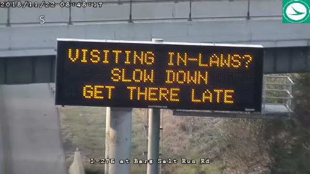 An Ohio Department of Transportation roadside safety sign that says: "Visiting the in-laws? Slow down. Get there late."