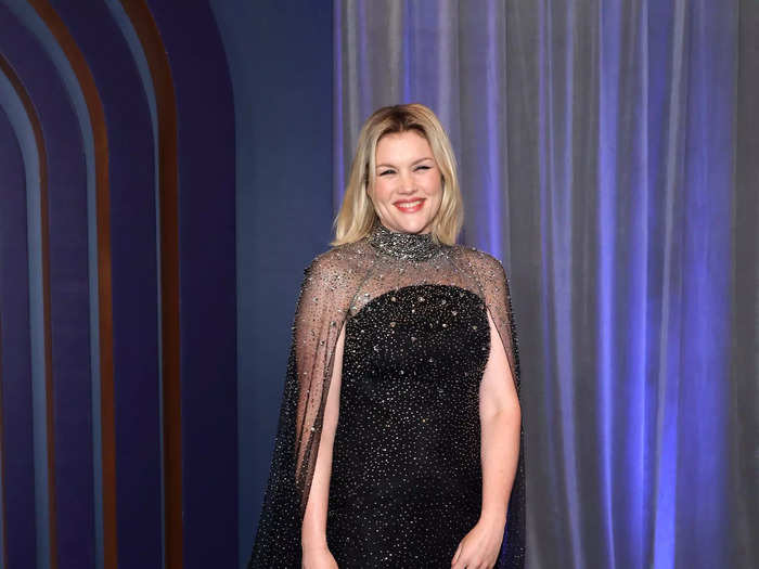Emerald Fennell opted for a floor-length glittering gown with a high neckline and sheer cape.