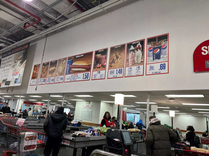 Above the checkout lines, signs advertised the food court