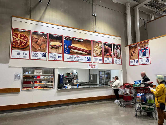 The food court was located beyond the checkout counters and sold pizza, chicken bakes, sandwiches, hot dogs, and desserts like churros and ice-cream sundaes.