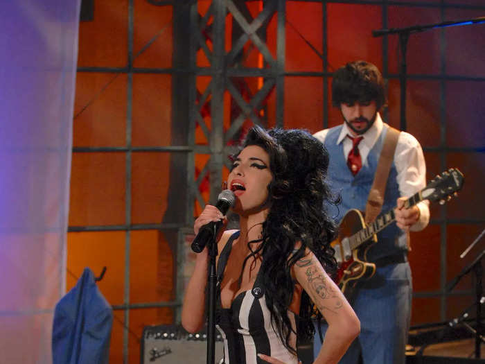 For her live performance on "The Tonight Show with Jay Leno," Winehouse wore a striped minidress with her now-iconic beehive hairstyle. 