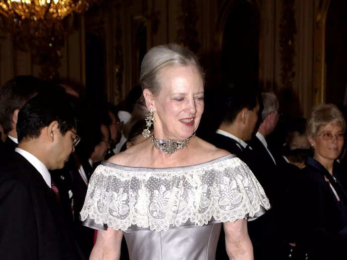 The queen wore a corset dress with an off-the-shoulder lace neckline during a visit to Japan in 2004.