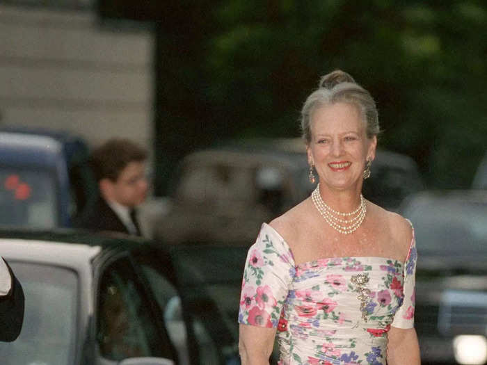 The queen proved to be a fan of florals over the years. In 1999, she wore an off-the-shoulder gown adorned with poppies and a handful of other flower prints.