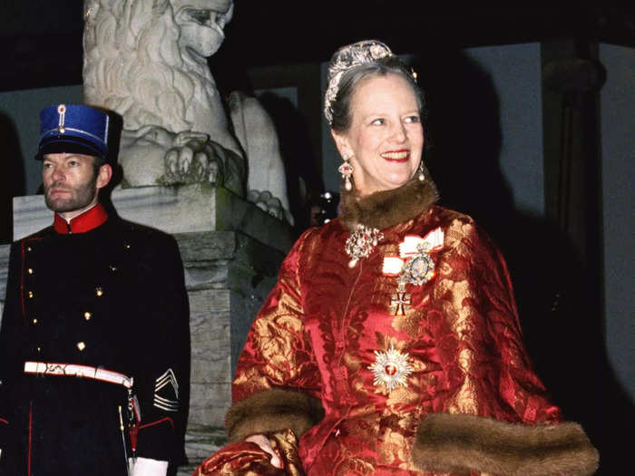 At the wedding of Prince Joachim and Princess Alexandra in 1995, the queen wore a bright-orange coatdress with a fur-lined collar and sleeves with matching orange heels.