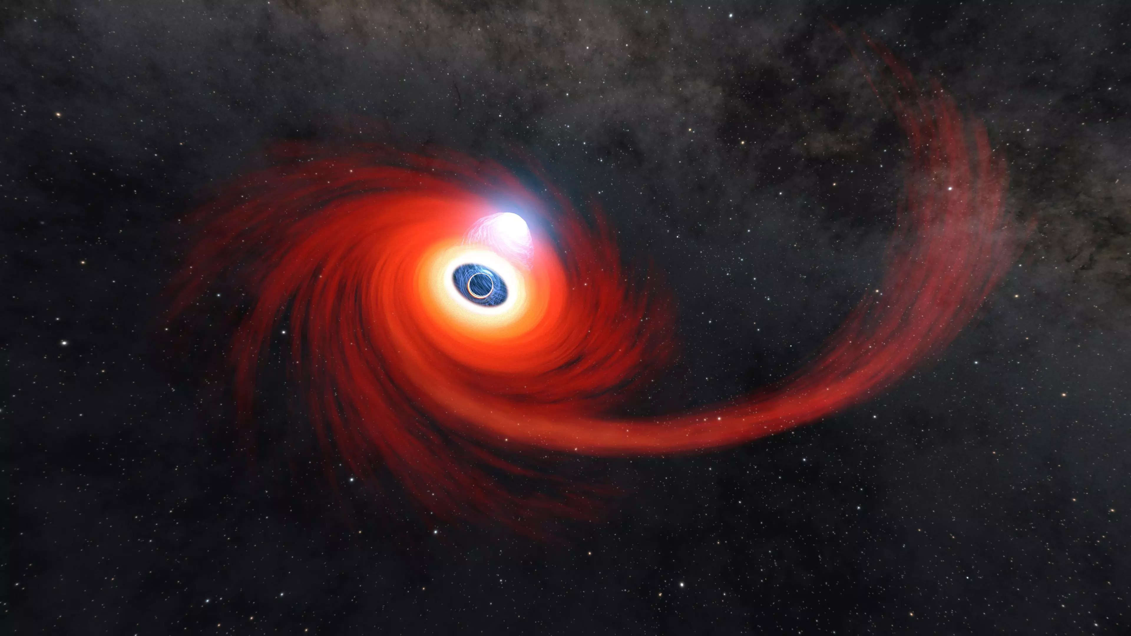 illustration shows black hole dark circle surrounded by spiraling red gas in space
