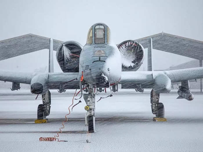 A seven-barrel cannon covered in snow