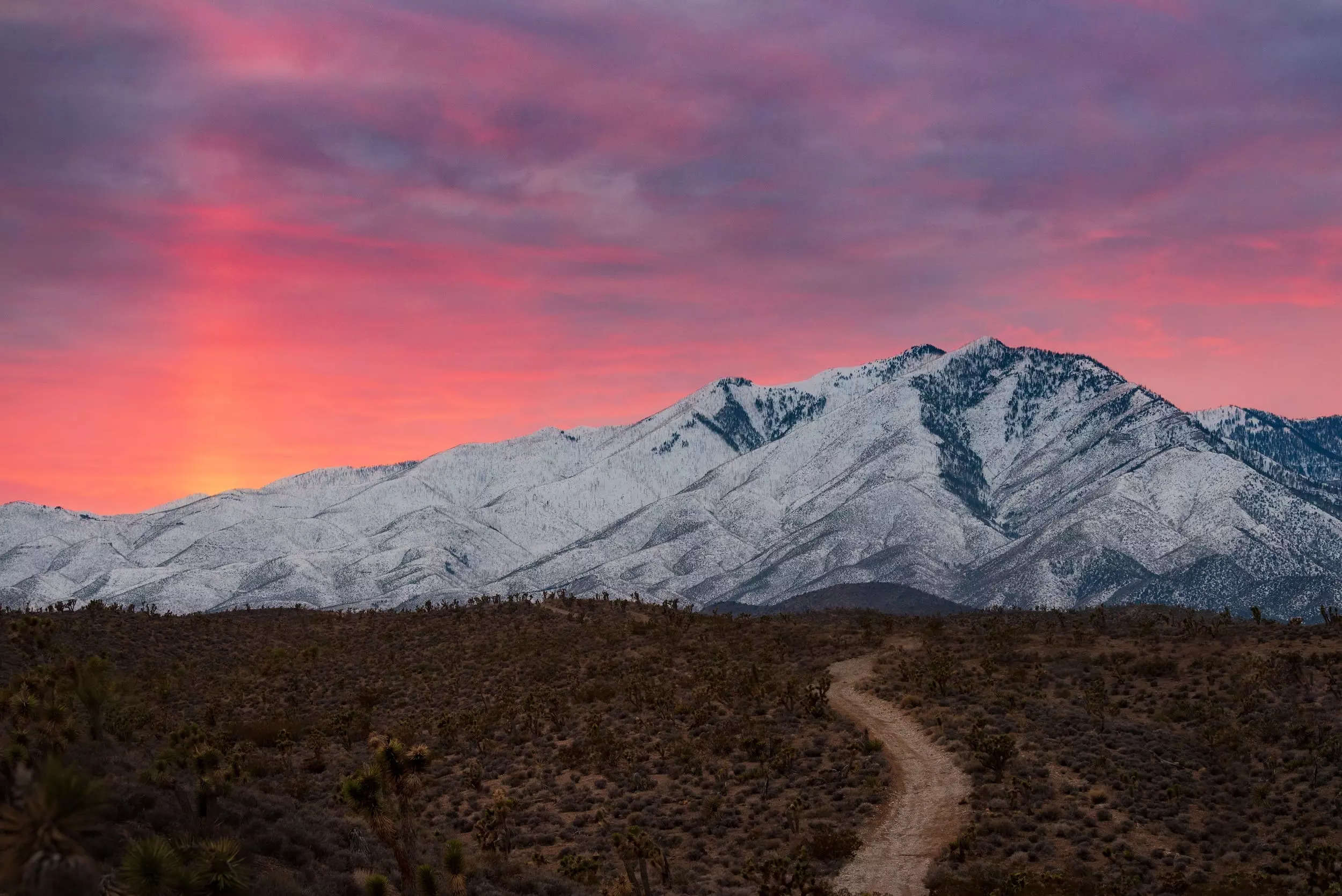 Snowcapped mountains against sky during sunset in Nevada.