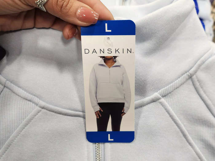 Stay stylish and warm with the Danskin cozy half-zip pullover.