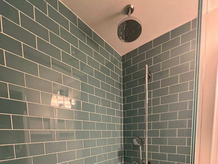 The oversized shower next to the sink came with a rainfall shower head.