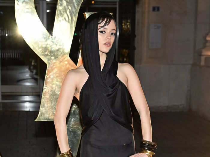 Later that month, the star wore a hooded black Saint Laurent gown to Paris Fashion Week. 