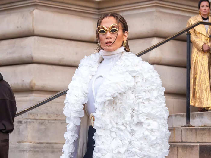 Jennifer Lopez wore a white coat adorned with thousands of real rose petals. 