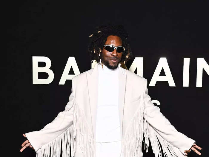 Rapper Saint Jhn wore all-white and a long jacket with fringe detailing.  